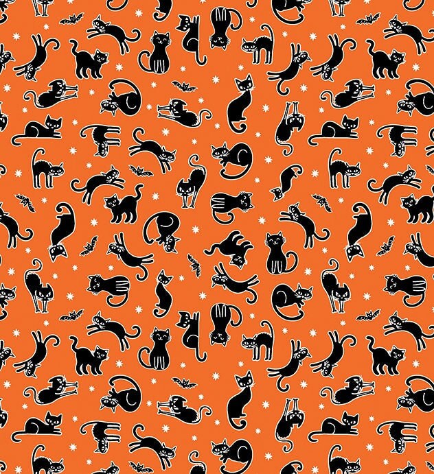 small black cats and bats on orange fabric with glow in dark outlines and stars