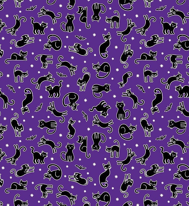 small black cats and bats on purple fabric with glow in dark outlines and stars