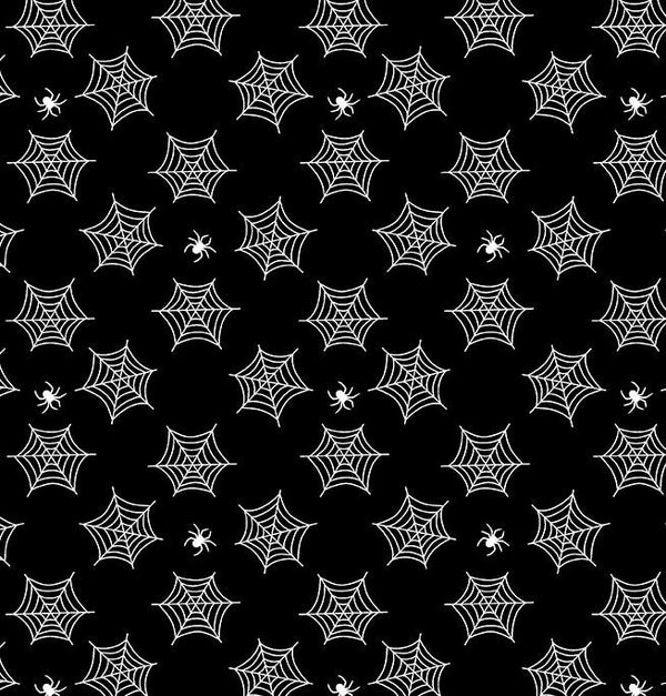small glow in the dark spiderwebs and spiders on black fabric
