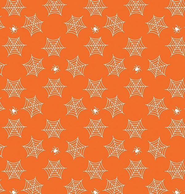 small glow in the dark spiderwebs and spiders on orange fabric